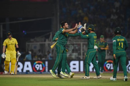 Photo for October 16, 2023, Kolkata ,India:Tabraiz Shamsi of South Africa celebrates with teammates Quinton de Kock and Aiden Markram after dismissing Marnus Labuschagne of Australia (not pictured) - Royalty Free Image