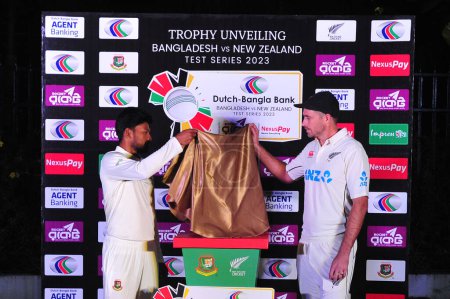 Photo for 27 November 2023 Sylhet-Bangladesh: Najmul Hossain Shanto (Bangladesh Captain) and Tim Southee (New Zealand Captain) unveiled the Dutch-Bangla Bank Test Series 2023 trophy in Sylhet - Royalty Free Image