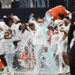 December 2, 2023, Arlington, Texas, United States: Texas Longhorns t head coach Steve Sarkisian receives a Gatorade shower after the conclusion of the 2023 Dr Pepper Big 12 Championship game between Texas Longhorns and Oklahoma State Cowboys