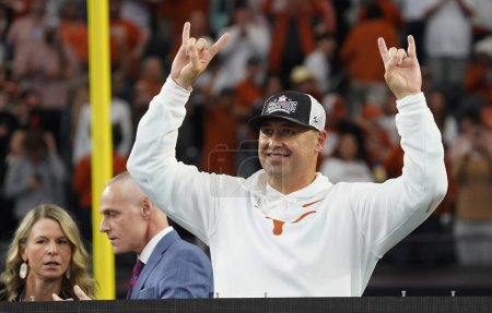 Photo for December 2, 2023, Arlington, Texas, United States: Texas Longhorns coach Steve Sarkisian makes the Hook 'Em Horns sign after defeating Oklahoma State and winning the 2023 Dr Pepper Big 12 Championship - Royalty Free Image