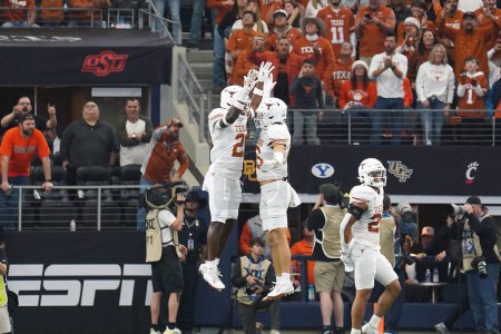 Photo for December 2, 2023, Arlington, Texas, United States:Texas Longhorns  players celebrate a touchdown during the 2023 Dr Pepper Big 12 Championship game between Texas Longhorns  and Oklahoma State Cowboys - Royalty Free Image