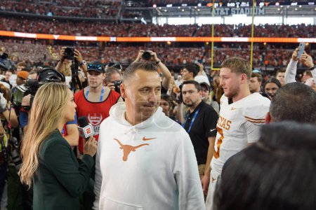 Photo for December 2, 2023,  Arlington, Texas, United States: Austin head coach Steve Sarkisian finishes his television interview after the conclusion of the 2023 Dr Pepper Big 12 Championship game between Texas and Oklahoma State at AT&T Stadium - Royalty Free Image