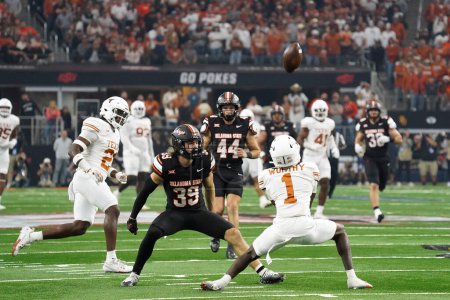 Photo for December 2, 2023, Arlington, Texas, United States: Texas Longhorns  player Xavier Worthy receives the punt during the 2023 Dr Pepper Big 12 Championship game between Texas Longhorns  and Oklahoma State Cowboys - Royalty Free Image