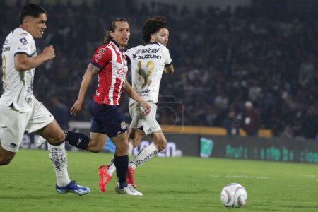 Photo for December 3, 2023, Mexico City, Mexico: Csar Huerta of Pumas of the UNAM in action  against Fernando Gonzlez  of Chivas of Guadalajara during the second leg of the quarterfinals of the  Opening Tournament of MX League - Royalty Free Image