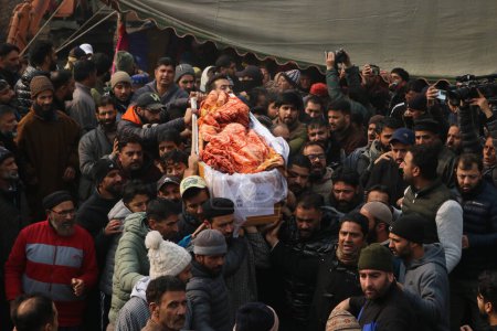 Photo for December 08,2023, Srinagar Kashmir, India : Kashmiris carry the coffin containing the body of slain Indian police Inspector Masroor Ahmad Wani during his funeral procession in Srinagar - Royalty Free Image