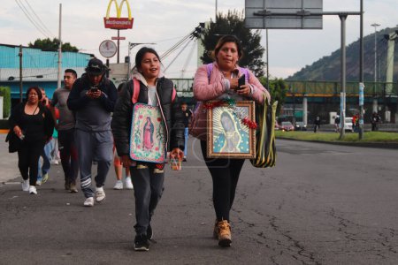 Photo for December 11, 2023 in Mexico City, Mexico:  Thousands of pilgrims from various states of Mexico walk on Ignacio Zaragoza Avenue towards the Basilica of Guadalupe to celebrate the day of the Virgin - Royalty Free Image