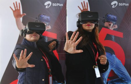 Photo for December 12,2023, Srinagar Kashmir, India : Women members of Bharti Airtel poses for Picture during live 5G plus experience in Srinagar. Airtel announced the launch of its cutting edge 5G services - Royalty Free Image