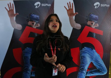 Photo for December 12,2023, Srinagar Kashmir, India : A woman member of Bharti Airtel speaks during live 5G plus experience in Srinagar. Airtel announced the launch of its cutting edge 5G services - Royalty Free Image