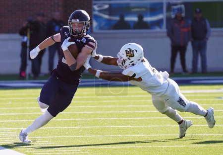 Photo for December 16, 2023, McKinney, Texas, United States: Harding's linebacker Jordan Mays pushes Colorado's wide receiver Max McLeod out of bounds during the NCAA Division II Football Championship between Harding University and Colorado School of Mines - Royalty Free Image