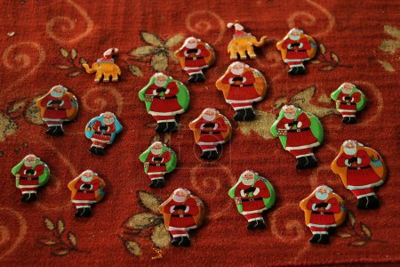 Photo for December 16,2023, Srinagar Kashmir, India : Christmas ornaments including Santa Claus are ready at the workshop before sending them to the market ahead of Christmas celebrations in Srinagar - Royalty Free Image
