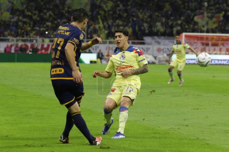 Photo for December 17, 2023, Mexico City, Mexico: Jess Angulo of Tigres of UANL in action against Alejandro Zendejas of Club America  during the second leg between America and Tigres of the Mexican football championship final - Royalty Free Image