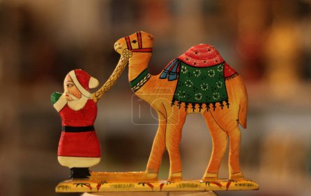 Photo for December 16,2023, Srinagar Kashmir, India : A Christmas gift is seen at the workshop ahead of Christmas celebrations in Srinagar. The artisans say that the Christmas items are made of papier-mache and are sent to local markets and also exported to th - Royalty Free Image
