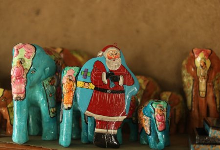 Photo for December 16,2023, Srinagar Kashmir, India : Christmas ornaments including Santa Claus are ready at the workshop before sending them to the market ahead of Christmas celebrations in Srinagar - Royalty Free Image