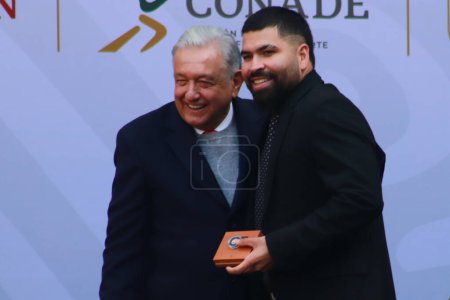 Photo for December 19, 2023 in Mexico City, Mexico: The president of Mexico, Andrs Manuel Lpez Obrador and Pitcher Jose Urquidy during the Award ceremony for the  2023 National Sports Award and Encouragement to the Delegations - Royalty Free Image