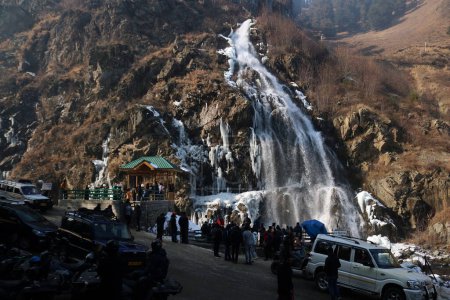 Photo for December 21,2023, Srinagar Kashmir, India : Visitors look at the frozen waterfall in Drung area of Tangmarg, north of Srinagar. The 40 day harshest winter period Chillai-Kalan, begins in Kashmir on Thursday - Royalty Free Image