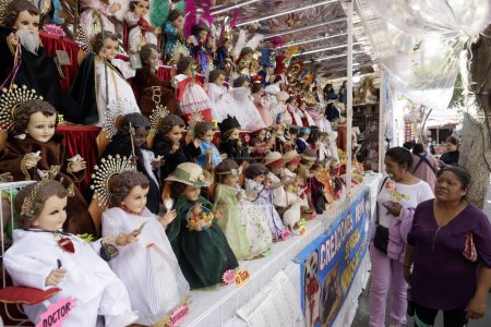 Photo for January 23, 2024, Mexico City, Mexico: Stores sell God child with costumes with various themes prior to the Candelaria Festival in the God child Square in Mexico City - Royalty Free Image