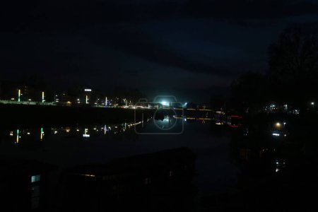 Photo for March 05, 2024, Srinagar, India : An illuminated bridge is seen across the Jhelum river at evening  in Srinagar - Royalty Free Image