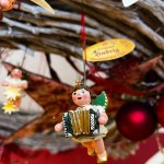 Christmas tree toy angel at the Christmas market. Traditional Seiffens toys. Angel plays the accordion. High quality photo