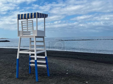 Bay watch tower on a beach in Costa Adeje, Tenerife, Canary Islands, Spain. Blue and white. Morning. High quality photo