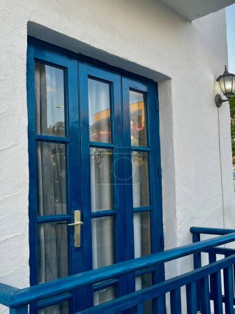 Blue window and white wall of house in Spain, Tenerife. Analogue greek houses. High quality photo