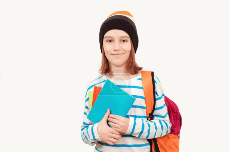 Photo for Cute teenager with school backpack. Back to school. Boy in casual clothes with books for studing. School boy with backpack holding books. Education concept. - Royalty Free Image