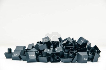 Photo for In the middle of a pile of keyboard keys are two keys that form the word "AI". - Royalty Free Image