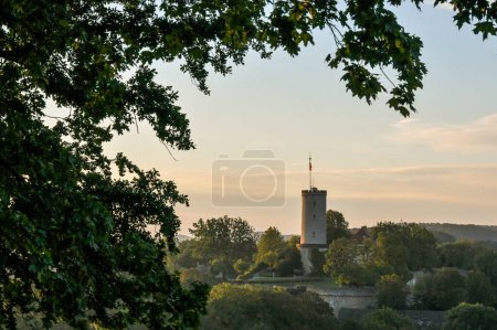 Photo for The Sparrenburg in Bielefeld at sunrise with tree in the foreground - Royalty Free Image