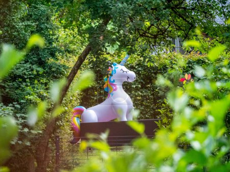 Photo for A life size plastic unicorn in a garden in the countryside - Royalty Free Image