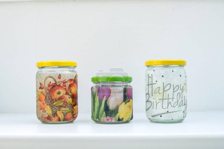 Photo for Three screw jars decorated with napkin technique - Royalty Free Image