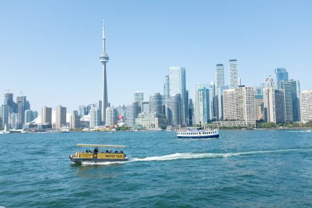 Photo for Toronto Ontario Canada Water taxi in Toronto Lake Ontario with CN Tower and skyline in background - Royalty Free Image