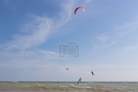 Photo for Toronto Ontario Canada People kiteboarding in Toronto at Kew beach on Lake Ontario on a windy day - Royalty Free Image