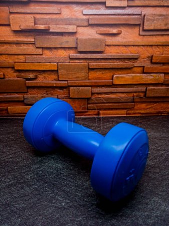 Photo for Blue colour 1kg Gym Dumble for fitness on the floor. - Royalty Free Image
