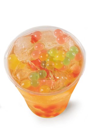 Photo for Bubble Tea, Isolated on White Background  Colorful, Fresh Orange Boba Drink with Fruit Fizzy Jellies and Ice Cubes, Wet with Droplets  Close Up Macro on Transparent Plastic Cup, Top View, from Above - Royalty Free Image