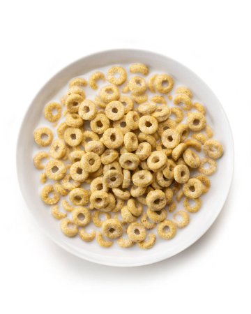 Foto de Tazón de anillos de maíz dulce con leche aislada sobre fondo blanco, vista superior - Imagen libre de derechos