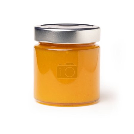 Photo for Orange marmalade jars or Apricot Jam jar - Round Glass Jar, Macro Close Up on Foam - Isolated on White Background, Free packaging - Royalty Free Image