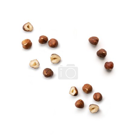 Photo for Pieces of tasty hazelnuts on white background - Royalty Free Image