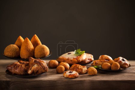 Photo for Typical Sicilian street food, Arancini - Arancina, Pizzette, Tavola Calda from Sicily  - different types - Royalty Free Image