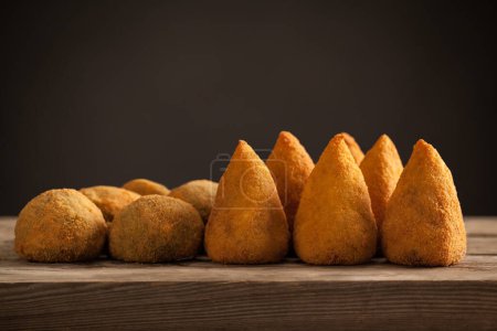 Photo for Typical Sicilian street food, Arancini - Arancina from Sicily  - different types - Royalty Free Image