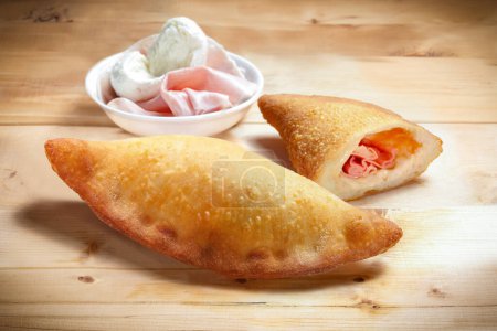Photo for Pizza "Siciliana Fritta" Typical Sicilian Fried Dough with Mozzarella Cheese, Cooked Ham - Royalty Free Image