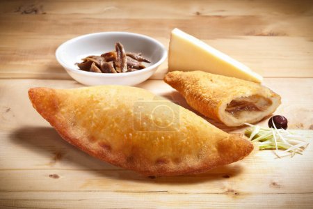 Pizza "Siciliana Fritta" Typical Sicilian Fried Dough with Tuma Cheese and Anchovies