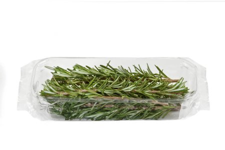 Photo for Rosemary Branches - plastic Package Wrapped in Clear Plastic - Isolated on White Background - Royalty Free Image