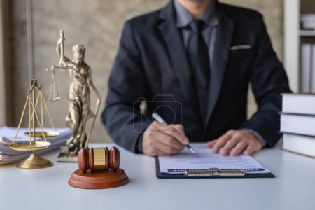 Photo for Judge with hammer and scales on table, concept of court and justice, lawyer, justice, consultant in suit working on documents at law office - Royalty Free Image
