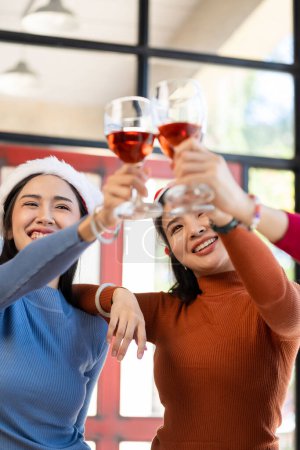 Photo for Group of Asian female friends at a party Have a fun time together. pizza party wine drinks Celebrating an important moment - Royalty Free Image