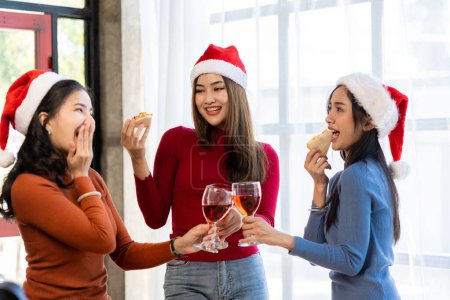 Photo for Group of Asian female friends at a party Have a fun time together. pizza party wine drinks Celebrating an important moment - Royalty Free Image