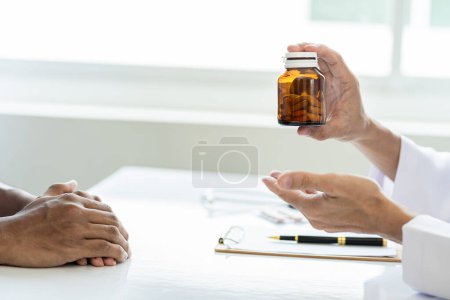 Photo for Doctor consulting patient sitting in doctor's office. Diagnosis. Disease prevention. health care Medical services, counseling from a distance - Royalty Free Image