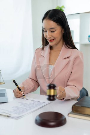 Photo for Legal genius female lawyer working with laptop in law office, judge hammer with justice, justice concept - Royalty Free Image