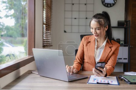 Photo for Executive female manager using laptop computer to talk, hybrid meeting, video leading, virtual meeting or online training, home office, finance concept - Royalty Free Image