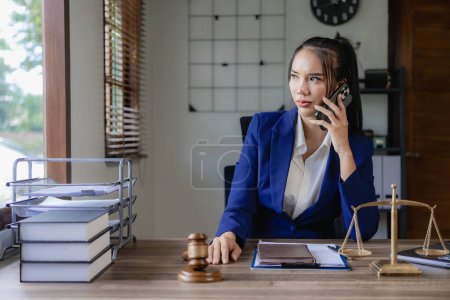 Photo for Asian female lawyer discussing legal case negotiation lease or sale agreement Female lawyer consulting with clients online - Royalty Free Image