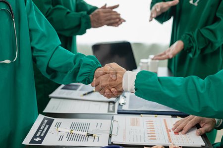 Photo for Medical team or doctor holding hands in interview Good job or successful promotion at the meeting Congratulations hospital or medical personnel, close-up image - Royalty Free Image