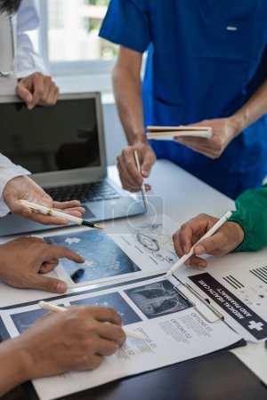 Photo for Meetings and laptops for office teams to discuss brainstorming and planning. Doctors, nurses, and computers on desks demonstrate the diversity of collaboration. Close-up pictures - Royalty Free Image